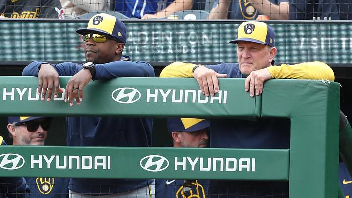 May 25, 2025; Pittsburgh, Pennsylvania, USA;  Milwaukee Brewers associate manager Rickie Weeks Jr. (left) and manager Pat Murphy (right) look on over the dugout railing against the Pittsburgh Pirates during the ninth inning at PNC Park. Mandatory Credit: Charles LeClaire-Imagn Images
