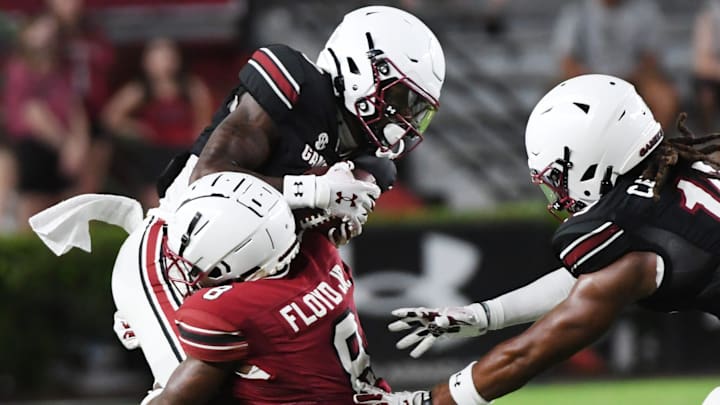 The University of South Carolina Spring football game took place at William-Brice Stadium on April 24, 2024. USC's Mazeo Bennett (3) is hit by Emory Floyd (8) on a play.