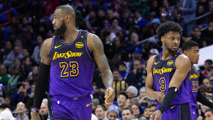 Jan 28, 2025; Philadelphia, Pennsylvania, USA; Los Angeles Lakers forward LeBron James (23) and guard Bronny James (9) look on during the third quarter against the Philadelphia 76ers at Wells Fargo Center. Mandatory Credit: Bill Streicher-Imagn Images