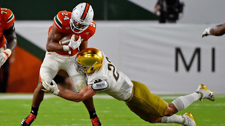 Nov 11, 2017; Miami Gardens, FL, USA; Notre Dame Fighting Irish linebacker Asmar Bilal (22) tackles Miami Hurricanes running back Travis Homer (24) during the second half at Hard Rock Stadium. Mandatory Credit: Jasen Vinlove-Imagn Images Nov 11, 2017; Miami Gardens, FL, USA; Notre Dame Fighting Irish linebacker Asmar Bilal (22) tackles Miami Hurricanes running back Travis Homer (24) during the second half at Hard Rock Stadium. Mandatory Credit: Jasen Vinlove-Imagn Images