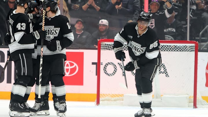 Apr 7, 2025; Los Angeles, California, USA;  Los Angeles Kings right wing Quinton Byfield (55, right) skates back to the bench after scoring a goal during the first period against the Seattle Kraken at Crypto.com Arena. Mandatory Credit: Kiyoshi Mio-Imagn Images