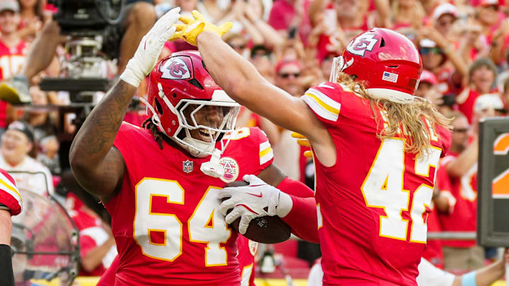 Sep 15, 2024; Kansas City, Missouri, USA; Kansas City Chiefs offensive tackle Wanya Morris (64) celebrates with running back Carson Steele (42) after scoring a touchdown  during the second half against the Cincinnati Bengals at GEHA Field at Arrowhead Stadium. Mandatory Credit: Jay Biggerstaff-Imagn Images