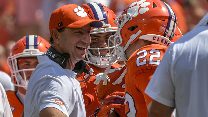 Sep 21, 2024; Clemson, South Carolina, USA; Clemson Tigers wide receiver Cole Turner (22) celebrates with head coach Dabo Swinney after scoring a touchdown against the North Carolina State Wolfpack during the second quarter at Memorial Stadium. 