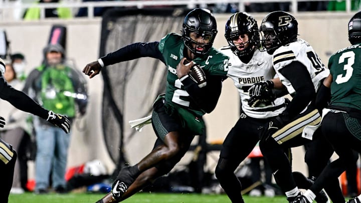 Michigan State's Aidan Chiles runs for a gain against Purdue during the first quarter on Friday, Nov. 22, 2024, at Spartan Stadium in East Lansing.