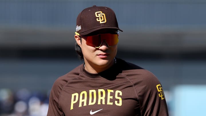 Oct 6, 2024; Los Angeles, California, USA; San Diego Padres shortstop Ha-Seong Kim (7) looks on during warm ups before game two against the Los Angeles Dodgers in the NLDS for the 2024 MLB Playoffs at Dodger Stadium.