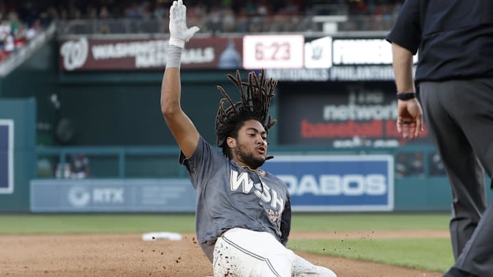 Sep 28, 2024; Washington, District of Columbia, USA; Washington Nationals outfielder James Wood (29) slides into third base after hitting a triple against the Philadelphia Phillies during the eighth inning at Nationals Park. 