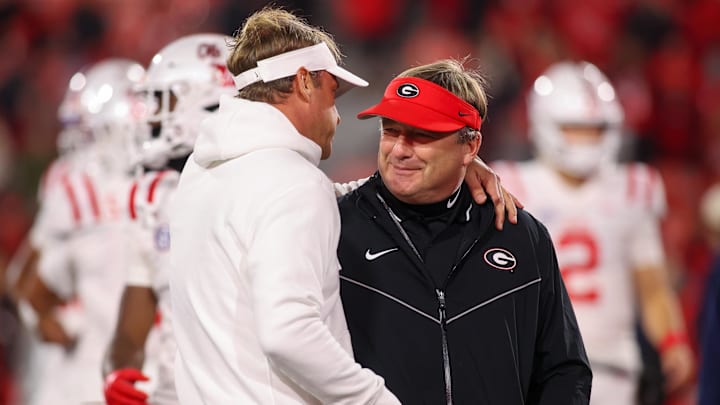 Nov 11, 2023; Athens, Georgia, USA; Mississippi Rebels head coach Lane Kiffin talks to Georgia Bulldogs head coach Kirby Smart before a game at Sanford Stadium. Mandatory Credit: Brett Davis-Imagn Images
