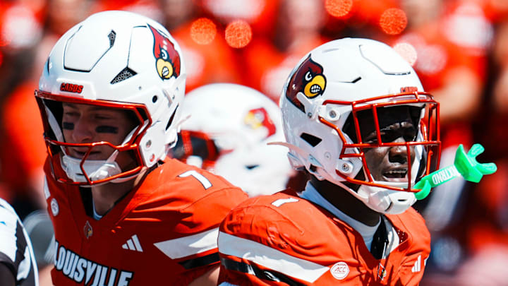 Louisville Cardinals running back Isaac Brown, right, celebrates one of his two touchdowns in the first half as the Cards' 51-17 win over Eastern Kentucky University at the Cardinals' season opener Saturday, August 30, 2025 at L&N Federal Credit Union Stadium in Louisville, Kentucky. At left is quarterback Miller Moss. Louisville Cardinals running back Isaac Brown, right, celebrates one of his two touchdowns in the first half as the Cards' 51-17 win over Eastern Kentucky University at the Cardinals' season opener Saturday, August 30, 2025 at L&N Federal Credit Union Stadium in Louisville, Kentucky. At left is quarterback Miller Moss.
