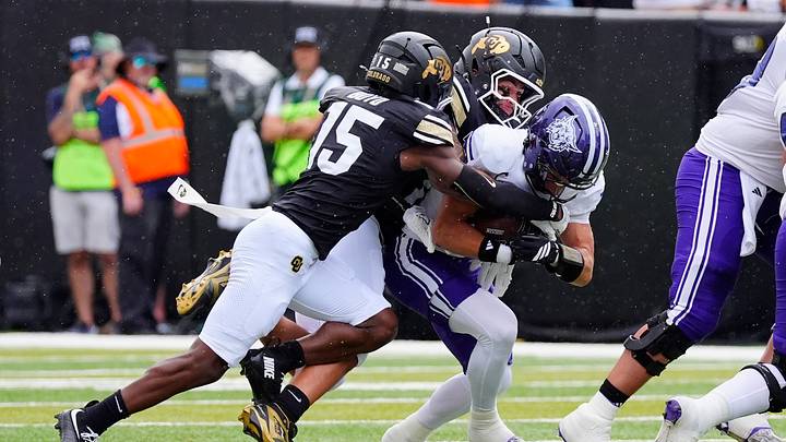 Sep 12, 2026; Boulder, Colorado, USA; Weber State Wildcats running back Omar Shah (0) is tacked by Colorado Buffaloes defensive back Jah Jah Boyd (15) and linebacker Tyler Martinez (35) in the first quarter at Folsom Field. Mandatory Credit: Ron Chenoy-Imagn Images Sep 12, 2026; Boulder, Colorado, USA; Weber State Wildcats running back Omar Shah (0) is tacked by Colorado Buffaloes defensive back Jah Jah Boyd (15) and linebacker Tyler Martinez (35) in the first quarter at Folsom Field. Mandatory Credit: Ron Chenoy-Imagn Images