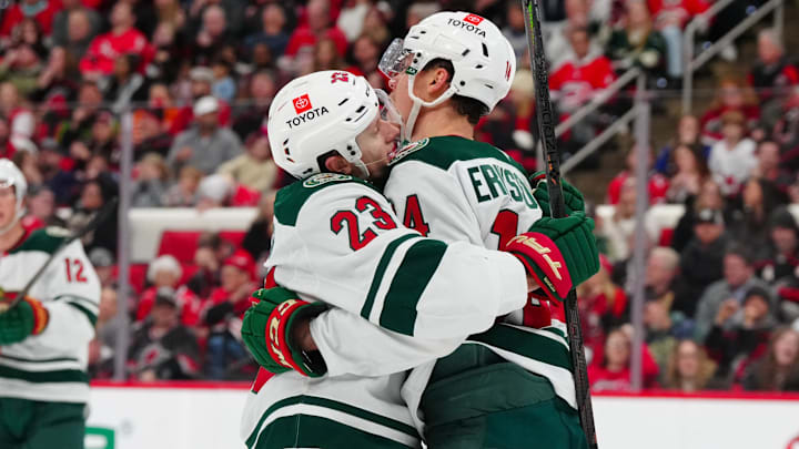 Jan 4, 2025; Raleigh, North Carolina, USA;  Minnesota Wild center Joel Eriksson Ek (14) celebrates his goal with center Marco Rossi (23) against the Carolina Hurricanes during the second period at Lenovo Center. Mandatory Credit: James Guillory-Imagn Images