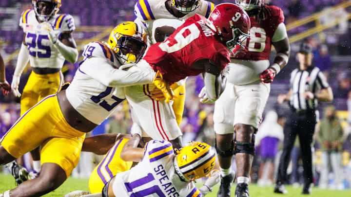 Nov 9, 2024; Baton Rouge, Louisiana, USA;  Alabama Crimson Tide running back Richard Young (9) is tacked by LSU Tigers defensive end Gabriel Reliford (19) and safety Dashawn Spears (10) during the second half at Tiger Stadium. Mandatory Credit: Stephen Lew-Imagn Images