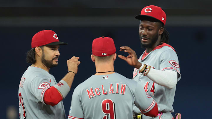 Apr 9, 2026; Miami, Florida, USA; Cincinnati Reds third baseman Eugenio Suarez (28) and shortstop Elly de la Cruz (44) speak to second baseman Matt McLain (9) during a mound visit against the Miami Marlins in the fifth inning at loanDepot Park. Mandatory Credit: Sam Navarro-Imagn Images