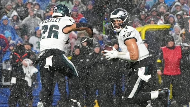 Dec 28, 2025; Orchard Park, New York, USA; Philadelphia Eagles quarterback Jalen Hurts (1) fakes a handoff to running back Saquon Barkley (26) against the Buffalo Bills during the first quarter at Highmark Stadium. Dec 28, 2025; Orchard Park, New York, USA; Philadelphia Eagles quarterback Jalen Hurts (1) fakes a handoff to running back Saquon Barkley (26) against the Buffalo Bills during the first quarter at Highmark Stadium.