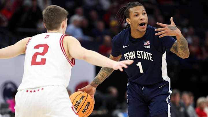Penn State guard Ace Baldwin Jr. (1) calls a play during a 2024 game as Indiana guard Gabe Cupps (2) defends. 