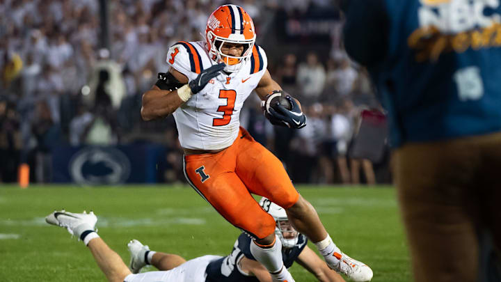 Illinois running back Kaden Feagin (3) runs near the sideline while carrying the ball in the first quarter of a Big Ten football game against Penn State, Saturday, Sept. 28, 2024, in State College, Pa.