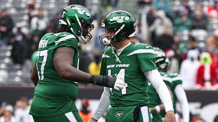Dec 24, 2023; East Rutherford, New Jersey, USA; New York Jets quarterback Trevor Siemian (14) and offensive tackle Carter Warren (67) on the field before the game against the Washington Commanders at MetLife Stadium. Mandatory Credit: Vincent Carchietta-Imagn Images