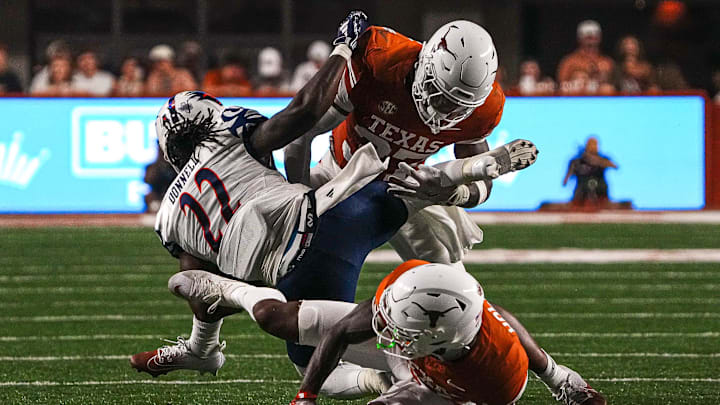 Texas Longhorns linebacker Morice Blackwell Jr. (37) tackles UTSA running back Bryson Donnell (22) during the game against UTSA at Darrell K Royal–Texas Memorial Stadium.