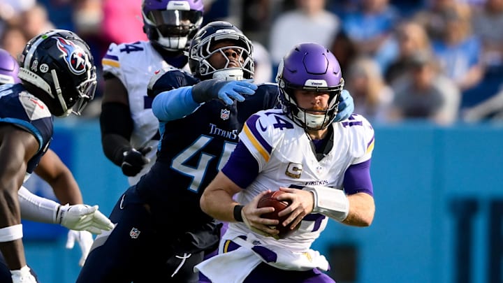 Nov 17, 2024; Nashville, Tennessee, USA;  Tennessee Titans linebacker Arden Key (49) sacks Minnesota Vikings quarterback Sam Darnold (14) during the second half at Nissan Stadium. Mandatory Credit: Steve Roberts-Imagn Images