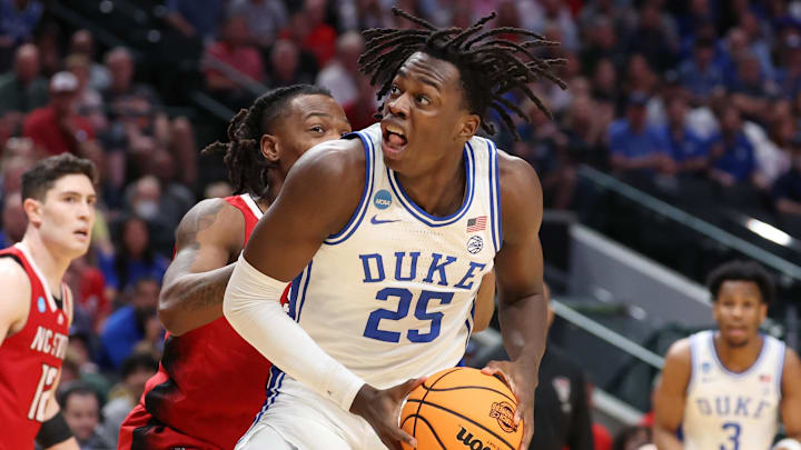 Mar 31, 2024; Dallas, TX, USA; Duke Blue Devils forward Mark Mitchell (25) controls the ball against an NC Stet defender in the Elite Eight of the NCAA Tournament.