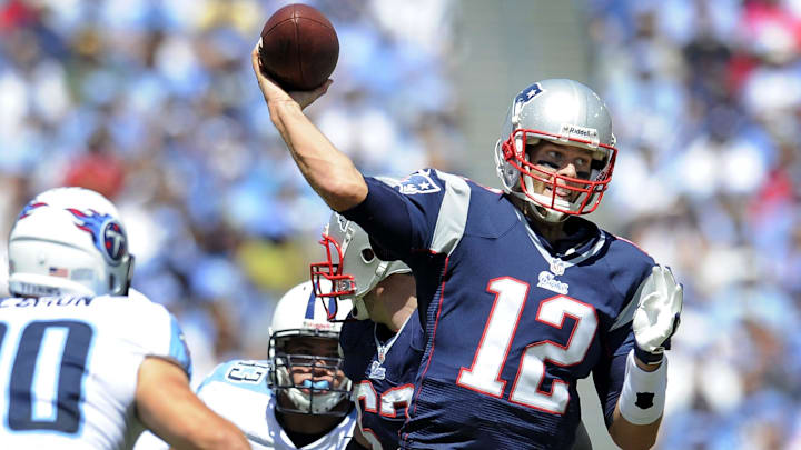 New England Patriots quarterback Tom Brady (12) throws a touchdown pass New England Patriots quarterback Tom Brady (12) throws a touchdown pass