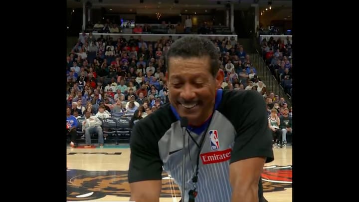 Ref Bill Kennedy laughs while announcing the outcome of a foul review on Feb. 28, 2025.