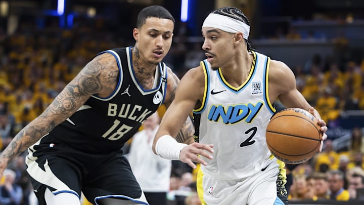 Apr 19, 2025; Indianapolis, Indiana, USA; Indiana Pacers guard Andrew Nembhard (2) dribbles the ball while Milwaukee Bucks forward Kyle Kuzma (18) defends in the second half at Gainbridge Fieldhouse. Mandatory Credit: Trevor Ruszkowski-Imagn Images Apr 19, 2025; Indianapolis, Indiana, USA; Indiana Pacers guard Andrew Nembhard (2) dribbles the ball while Milwaukee Bucks forward Kyle Kuzma (18) defends in the second half at Gainbridge Fieldhouse. Mandatory Credit: Trevor Ruszkowski-Imagn Images
