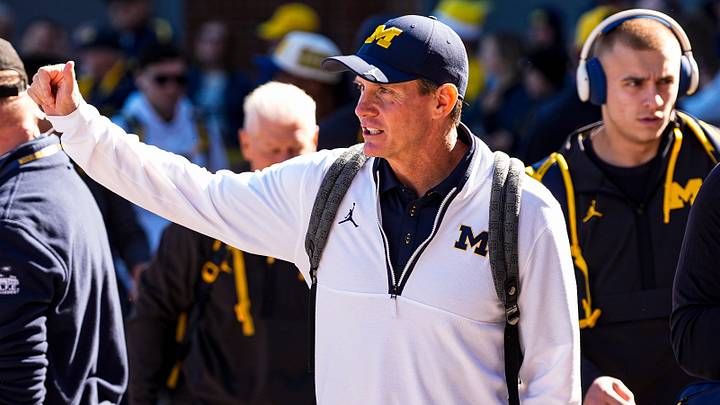 Michigan defensive coordinator Jay Hill waves at fans as the team arrives ahead of the game between Michigan and Penn State at Michigan Stadium in Ann Arbor on Saturday, Oct. 17, 2026. Michigan defensive coordinator Jay Hill waves at fans as the team arrives ahead of the game between Michigan and Penn State at Michigan Stadium in Ann Arbor on Saturday, Oct. 17, 2026.
