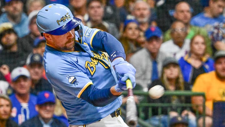 Sep 27, 2024; Milwaukee, Wisconsin, USA;  Milwaukee Brewers first baseman Rhys Hoskins (12) hits a grand slam home run against the New York Mets in the first inning at American Family Field. Mandatory Credit: Benny Sieu-Imagn Images