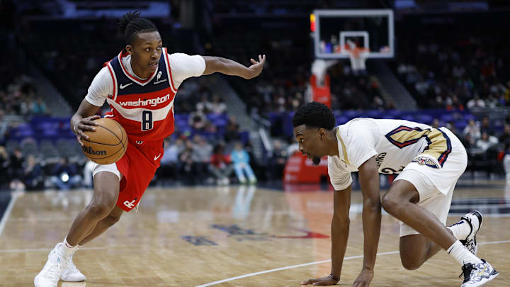 Jan 5, 2025; Washington, District of Columbia, USA; Washington Wizards guard Bub Carrington (8) drives to the basket as New Orleans Pelicans forward Herbert Jones (2) defends in the second quarter at Capital One Arena. Mandatory Credit: Geoff Burke-Imagn Images