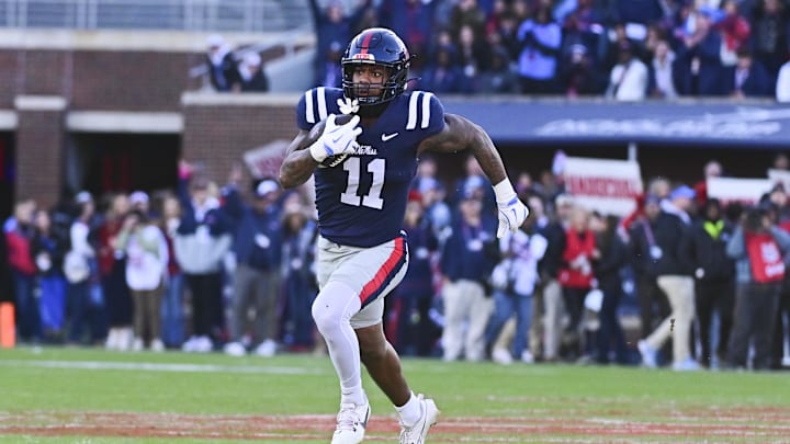 Nov 29, 2024; Oxford, Mississippi, USA; Mississippi Rebels linebacker Chris Paul Jr. (11) runs the ball after an interception against the Mississippi State Bulldogs during the first quarter at Vaught-Hemingway Stadium. Mandatory Credit: Matt Bush-Imagn Images Nov 29, 2024; Oxford, Mississippi, USA; Mississippi Rebels linebacker Chris Paul Jr. (11) runs the ball after an interception against the Mississippi State Bulldogs during the first quarter at Vaught-Hemingway Stadium. Mandatory Credit: Matt Bush-Imagn Images