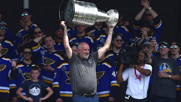 Jun 15, 2019; St. Louis, MO, USA; St. Louis Blues general manager Doug Armstrong hoists the Stanley Cup during the Stanley Cup championship parade and rally at the Gateway Arch. Mandatory Credit: Jeff Curry-Imagn Images