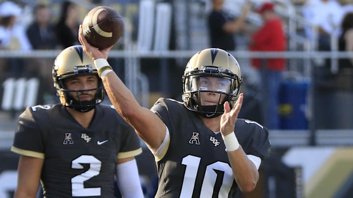 Sep 17, 2016; Orlando, FL, USA; UCF Knights quarterback McKenzie Milton (10) warms up by passing before a football game against the Marylan Terrapins at Bright House Networks Stadium. Mandatory Credit: Reinhold Matay-Imagn Images Sep 17, 2016; Orlando, FL, USA; UCF Knights quarterback McKenzie Milton (10) warms up by passing before a football game against the Marylan Terrapins at Bright House Networks Stadium. Mandatory Credit: Reinhold Matay-Imagn Images
