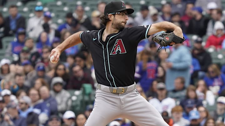Apr 19, 2025; Chicago, Illinois, USA; Arizona Diamondbacks pitcher Zac Gallen (23) throws the ball against the Chicago Cubs during the first inning at Wrigley Field. Mandatory Credit: David Banks-Imagn Images