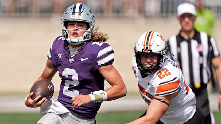 Avery Johnson (2) runs the football while being chased by Jeff Roberson during Kansas State's game against Oklahoma State on Sept. 28, 2024 in Manhattan, Kansas at Bill Snyder Family Stadium. 