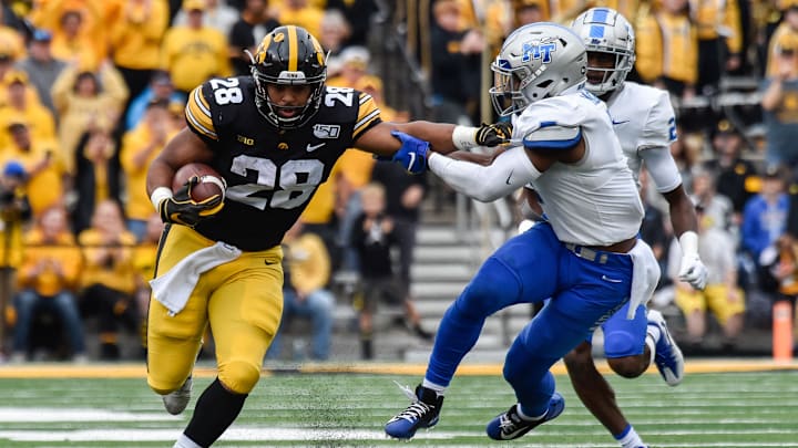 Sep 28, 2019; Iowa City, IA, USA; Iowa Hawkeyes running back Toren Young (28) runs the ball as Middle Tennessee Blue Raiders safety Jovante Moffatt (7) pursues during the third quarter at Kinnick Stadium. Mandatory Credit: Jeffrey Becker-Imagn Images