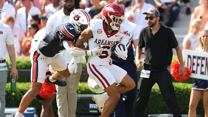 Sep 21, 2024; Auburn, Alabama, USA;  Auburn Tigers safety Jerrin Thompson (1) tackles Arkansas Razorbacks wide receiver Isaiah Sategna (6) during the first quarter at Jordan-Hare Stadium. Mandatory Credit: John Reed-Imagn Images