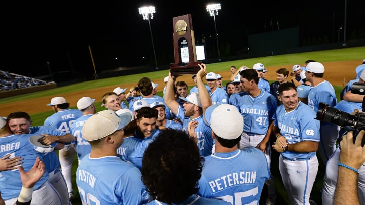 UNC baseball players lift the Super Regional trophy