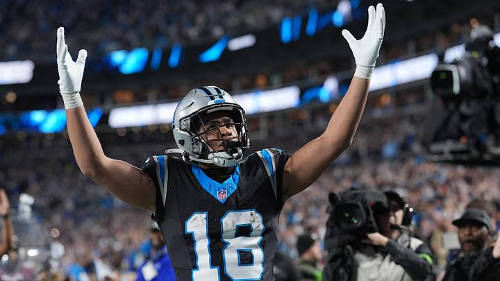 Carolina Panthers wide receiver Jalen Coker (18) reacts after making a touchdown against the Los Angeles Rams in the second half during the NFC Wild Card Round game at Bank of America Stadium. Mandatory Credit: Jim Dedmon-Imagn Images