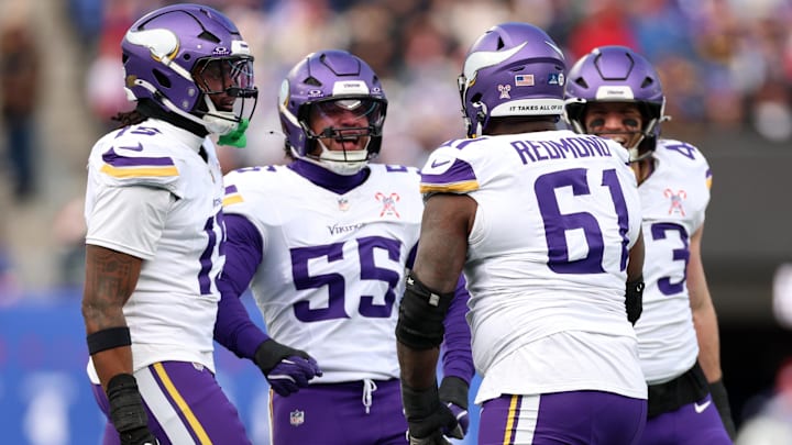 Dec 21, 2025; East Rutherford, New Jersey, USA; Minnesota Vikings defensive lineman Jalen Redmond (61) reacts with linebacker Eric Wilson (55) during the first half at MetLife Stadium. Dec 21, 2025; East Rutherford, New Jersey, USA; Minnesota Vikings defensive lineman Jalen Redmond (61) reacts with linebacker Eric Wilson (55) during the first half at MetLife Stadium.