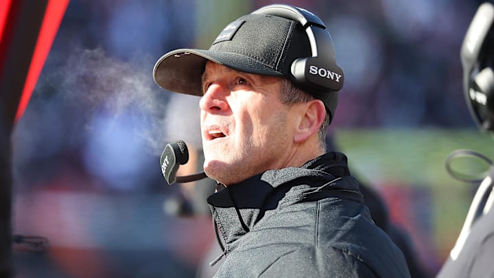 Dec 14, 2025; Cincinnati, Ohio, USA; Baltimore Ravens head coach John Harbaugh checks a replay during the second quarter against the Cincinnati Bengals at Paycor Stadium. Mandatory Credit: Joseph Maiorana-Imagn Images