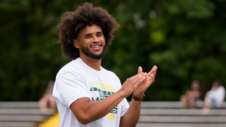 Oregon quarterback Dante Moore celebrates after a reception during a youth football camp at Marist Catholic High School on June 20, 2026, in Eugene, Oregon. Oregon quarterback Dante Moore celebrates after a reception during a youth football camp at Marist Catholic High School on June 20, 2026, in Eugene, Oregon.