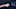Close-up of a child's hand scratching fingernails across a blackboard next to the word no