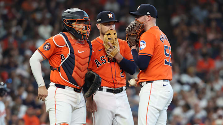 Oct 2, 2024; Houston, Texas, USA; Houston Astros pitcher Ryan Pressly (55) talks with catcher Yainer Diaz (21) and third base Alex Bregman (2) during the eighth inning of game two of the Wildcard round for the 2024 MLB Playoffs against the Detroit Tigers at Minute Maid Park. Mandatory Credit: Thomas Shea-Imagn Images