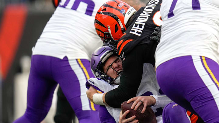 Cincinnati Bengals defensive end Trey Hendrickson (91) sacks Minnesota Vikings quarterback Nick Mullens (12) in the fourth quarter of the NFL Week 15 game between the Cincinnati Bengals and the Minnesota Vikings at PayCor Stadium in downtown Cincinnati on Saturday, Dec. 16, 2023. The Bengals won on an overtime field goal.