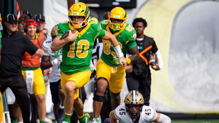 Oregon quarterback Luke Moga carries the ball as the Oregon Ducks host the Montana State Bobcats on Aug. 30, 2025, at Autzen Stadium in Eugene, Oregon. Oregon quarterback Luke Moga carries the ball as the Oregon Ducks host the Montana State Bobcats on Aug. 30, 2025, at Autzen Stadium in Eugene, Oregon.