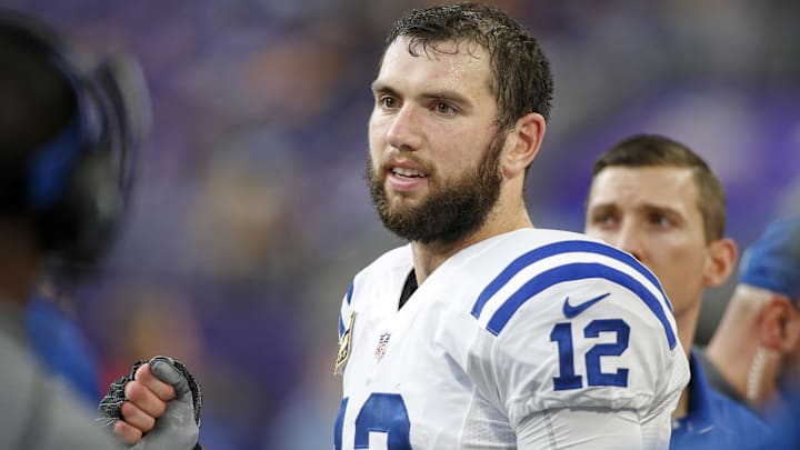 Dec 18, 2016; Minneapolis, MN, USA; Indianapolis Colts quarterback Andrew Luck (12) celebrates on his bench after leaving the game against the Minnesota Vikings in the fourth quarter at U.S. Bank Stadium. The Colts won 34-6.