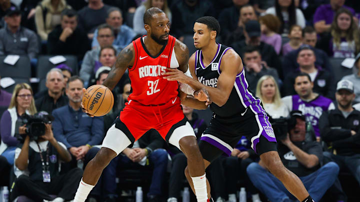 Jan 16, 2025; Sacramento, California, USA; Houston Rockets forward Jeff Green (32) dribbles the ball against Sacramento Kings forward Keegan Murray (13) during the first quarter at Golden 1 Center. Mandatory Credit: Sergio Estrada-Imagn Images