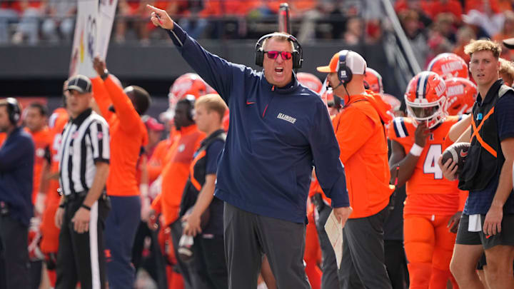Illinois Fighting Illini head coach Bret Bielema motions during the first half of the NCAA football game against the Ohio State Buckeyes at Gies Memorial Stadium in Champaign on Oct. 11, 2025.