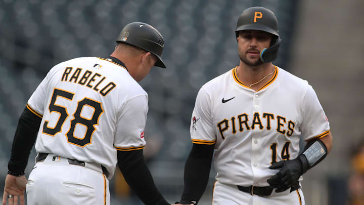 Apr 7, 2025; Pittsburgh, Pennsylvania, USA;  Pittsburgh Pirates third base coach Mike Rabelo (58) congratulates catcher Joey Bart (14) as he circles the bases on a solo home run against the St. Louis Cardinals during the first inning at PNC Park. Mandatory Credit: Charles LeClaire-Imagn Images