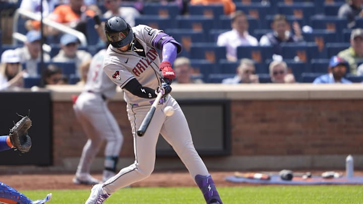 May 1, 2025; New York City, New York, USA; Arizona Diamondbacks left fielder Lourdes Gurriel Jr. (12) hits a single against the New York Mets during the fourth inning at Citi Field. Mandatory Credit: Gregory Fisher-Imagn Images May 1, 2025; New York City, New York, USA; Arizona Diamondbacks left fielder Lourdes Gurriel Jr. (12) hits a single against the New York Mets during the fourth inning at Citi Field. Mandatory Credit: Gregory Fisher-Imagn Images